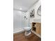 Modern bathroom showcasing white subway tile shower, wood-look vanity, and contemporary fixtures at 1330 Quebec St, Denver, CO 80220