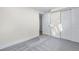 A bright bedroom features soft carpet and neutral paint, offering a versatile space at 1330 Quebec St, Denver, CO 80220