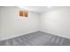 A bright bedroom features soft carpet and neutral paint, offering a versatile space at 1330 Quebec St, Denver, CO 80220