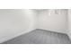 A bright bedroom features soft carpet and neutral paint, offering a versatile space at 1330 Quebec St, Denver, CO 80220
