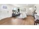 Bright living room with hardwood floors, large window, comfortable seating, and modern decor at 1330 Quebec St, Denver, CO 80220