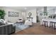 Open living area featuring hardwood floors, modern furniture, and a seamless transition to the kitchen at 1330 Quebec St, Denver, CO 80220