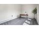 Bright home office featuring a modern wooden desk, accent wall, and plush carpet at 1330 Quebec St, Denver, CO 80220