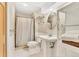 Classic bathroom with tiled floor, vanity, and a shower with curtain at 18940 Pebble Beach Way, Monument, CO 80132