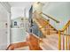 The entryway features hardwood floors, a staircase, and access to the living room at 18940 Pebble Beach Way, Monument, CO 80132