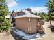 Exterior home view featuring wood siding, private decks and mature trees at 18940 Pebble Beach Way, Monument, CO 80132