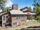 This two-story home offers large windows for natural light and beautiful wood siding at 18940 Pebble Beach Way, Monument, CO 80132