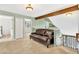 Upstairs hallway featuring a comfortable seating area with a view to the staircase at 18940 Pebble Beach Way, Monument, CO 80132