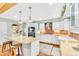 Updated kitchen featuring a center island, stainless steel appliances, and light countertops at 18940 Pebble Beach Way, Monument, CO 80132