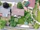 Aerial view showcasing a home with a spacious backyard, lush landscaping, and a charming garden area at 13126 W Warren Cir, Lakewood, CO 80228