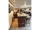 Basement bar featuring granite counters and seating for four, perfect for entertaining at 13126 W Warren Cir, Lakewood, CO 80228