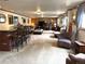 Entertaining basement featuring a bar area, comfortable seating, and a large open space at 13126 W Warren Cir, Lakewood, CO 80228