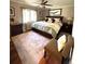 Cozy bedroom featuring a ceiling fan, large window, and comfortable bed with decorative pillows at 13126 W Warren Cir, Lakewood, CO 80228