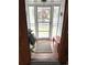 Bright foyer with large glass window, tile floors, and a bench at 13126 W Warren Cir, Lakewood, CO 80228