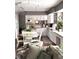 Open kitchen featuring an island, granite countertops, stainless steel appliances, white cabinets and an eating nook at 13126 W Warren Cir, Lakewood, CO 80228