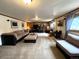 Finished basement with comfortable seating and media center at 13126 W Warren Cir, Lakewood, CO 80228