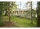 Charming single story home in a wooded setting featuring a cozy front porch at 29055 S Sunset Trl, Conifer, CO 80433
