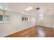 Bright basement featuring hardwood floors and windows, providing ample natural light at 3159 36Th Ave, Denver, CO 80211