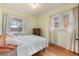 Bright bedroom featuring hardwood floors, neutral walls, and sunny windows at 3159 36Th Ave, Denver, CO 80211
