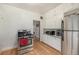 Bright kitchen with stainless steel appliances, white cabinets, hardwood floors, and ample counter space at 3159 36Th Ave, Denver, CO 80211