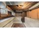 Unfinished basement featuring exposed beams, concrete foundation, and a unique built-in cabinet at 3159 36Th Ave, Denver, CO 80211
