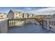 View of the backyard with an outdoor deck overlooking a well-manicured green lawn at 926 W Beverly St, Elizabeth, CO 80107