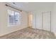 Bright bedroom features a large window and neutral decor, offering a serene and inviting atmosphere at 926 W Beverly St, Elizabeth, CO 80107