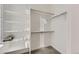 Organized walk-in closet with shelving and hanging rods for optimal storage at 926 W Beverly St, Elizabeth, CO 80107