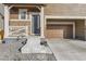Inviting home entrance with stylish front door, stone accents, and covered porch at 926 W Beverly St, Elizabeth, CO 80107