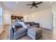 Open-concept living area with a cozy gray sectional sofa and a modern kitchen at 926 W Beverly St, Elizabeth, CO 80107