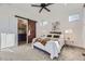 Bedroom features stylish barn door, plush carpeting, and neutral decor at 926 W Beverly St, Elizabeth, CO 80107