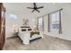 Bright bedroom with plush carpeting, natural light, and neutral decor at 926 W Beverly St, Elizabeth, CO 80107