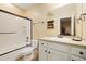Clean and modern bathroom with a shower-tub combo, white vanity, and ample lighting at 17452 W 83Rd Pl, Arvada, CO 80007