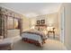Charming bedroom with floral accents, a cozy bed, and a bright window at 17452 W 83Rd Pl, Arvada, CO 80007