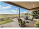 Inviting covered patio with comfortable seating and stunning views of the surrounding landscape at 17452 W 83Rd Pl, Arvada, CO 80007