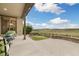 Beautiful outdoor patio with picturesque views of rolling hills and blue sky at 17452 W 83Rd Pl, Arvada, CO 80007