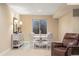 Cozy dining area featuring a round table, cushioned chairs, and a bright window well at 17452 W 83Rd Pl, Arvada, CO 80007