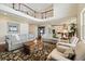 Open-concept living area with a view of the kitchen and upstairs loft at 17452 W 83Rd Pl, Arvada, CO 80007