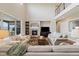 Inviting living room with fireplace, large windows, and comfortable seating at 17452 W 83Rd Pl, Arvada, CO 80007