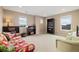 Bright living room with furniture and a bookcase with a lot of storage space at 17452 W 83Rd Pl, Arvada, CO 80007