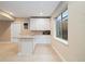Bright basement wet bar with white cabinets, sink, and convenient counter space for entertaining at 17452 W 83Rd Pl, Arvada, CO 80007