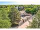 Sprawling home with multiple garages, mature trees, and a well-maintained lawn at 2299 Ranch Dr, Westminster, CO 80234