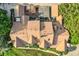 An aerial view of a house shows its unique roof design, as well as its backyard and driveway at 2299 Ranch Dr, Westminster, CO 80234