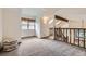 This bonus room offers lots of space and natural light, along with staircase access at 2299 Ranch Dr, Westminster, CO 80234