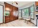 Cozy kitchen nook features ample cabinet space and a large window with tree views at 2299 Ranch Dr, Westminster, CO 80234