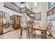 Bright dining room with an elegant wooden table, chandelier, and hardwood floors at 2299 Ranch Dr, Westminster, CO 80234