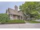 Exterior view featuring a charming house with brick and tile roofing complemented by well-kept landscaping at 2299 Ranch Dr, Westminster, CO 80234