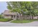Charming brick home with a well-manicured lawn and mature trees at 2299 Ranch Dr, Westminster, CO 80234