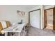 Functional home office features a workspace, closet, and easy access to the adjacent bathroom at 2299 Ranch Dr, Westminster, CO 80234