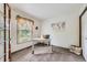 Comfortable home office with natural light from window and modern decor including a world map at 2299 Ranch Dr, Westminster, CO 80234